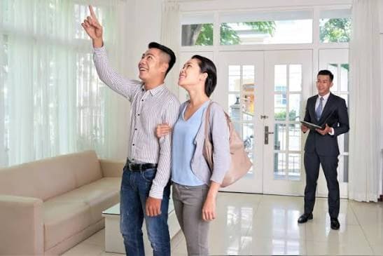 A bright spacious family home being viewed by a couple
