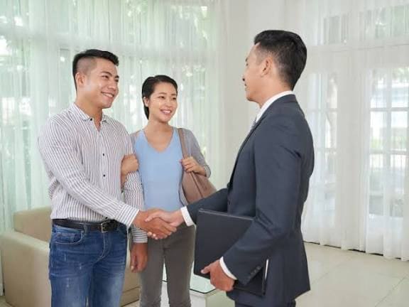 A warm welcome for a couple during a property consultation